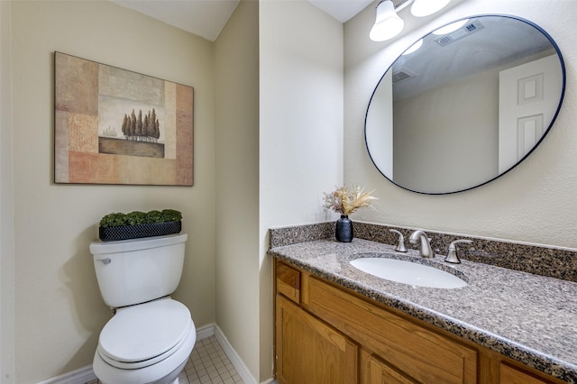 bathroom featuring vanity, toilet, baseboards, and visible vents