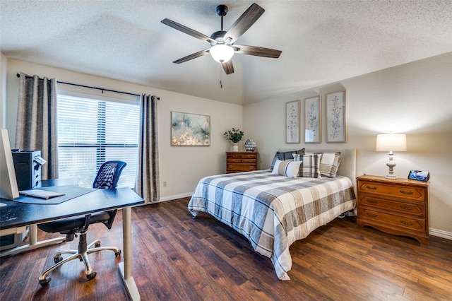 bedroom featuring a textured ceiling, a ceiling fan, baseboards, and wood finished floors