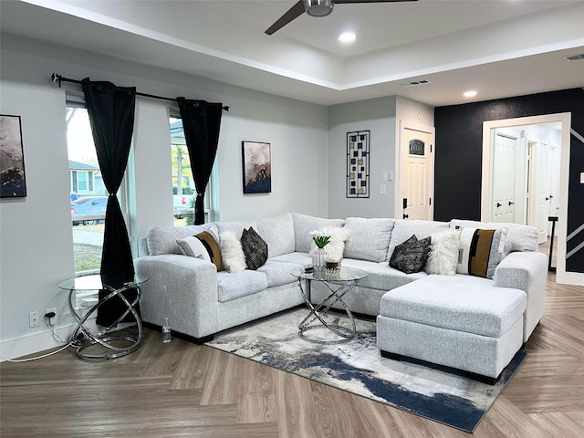 living room featuring recessed lighting, ceiling fan, visible vents, and baseboards