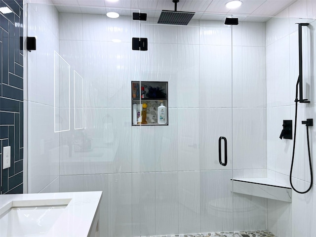 full bath featuring a stall shower and vanity