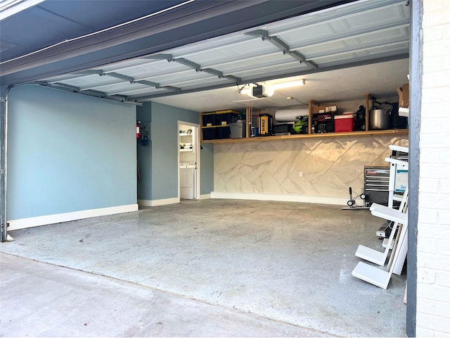 garage with a garage door opener and baseboards