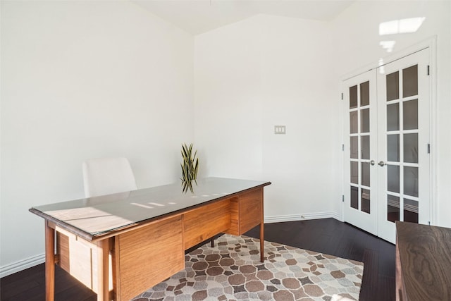 office space featuring dark wood-type flooring, french doors, baseboards, and lofted ceiling