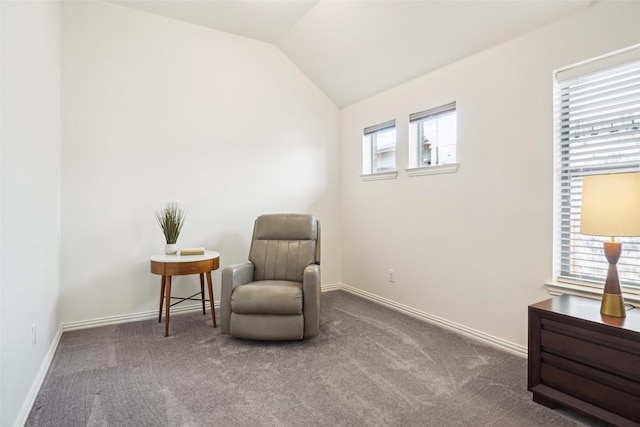 sitting room with lofted ceiling, carpet flooring, and baseboards