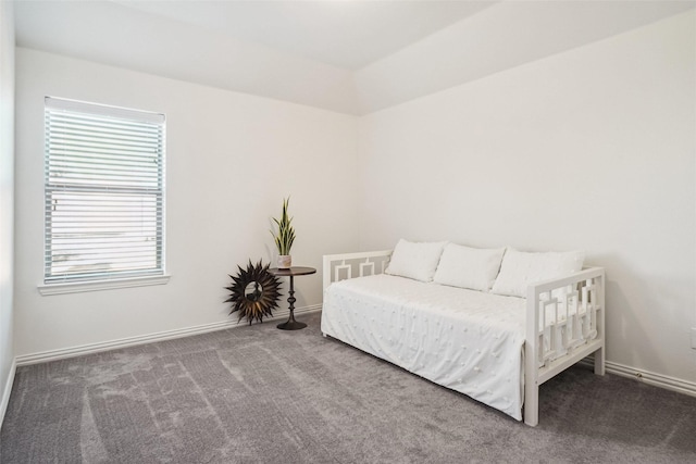 carpeted bedroom featuring baseboards