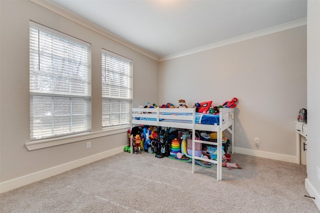 carpeted bedroom featuring baseboards and ornamental molding