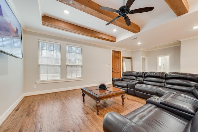 living area featuring crown molding, baseboards, beamed ceiling, attic access, and light wood-style flooring