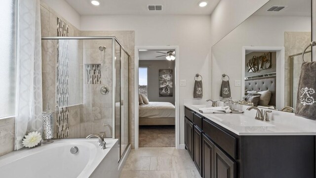 full bath featuring visible vents, connected bathroom, a shower stall, and a sink