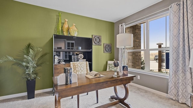 carpeted home office with baseboards and plenty of natural light