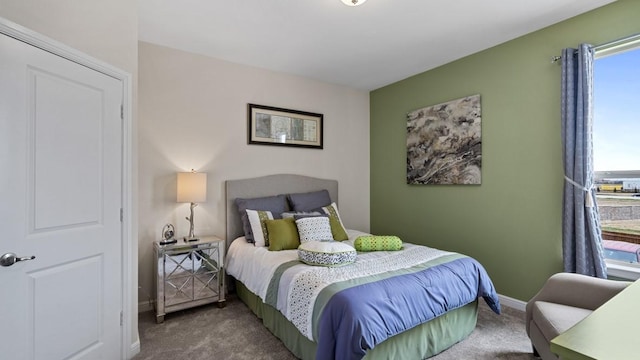 carpeted bedroom with baseboards