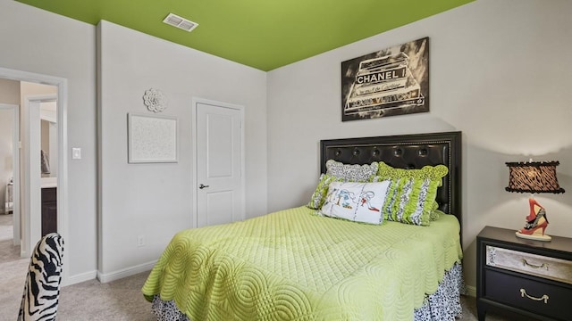 bedroom with carpet flooring, baseboards, and visible vents