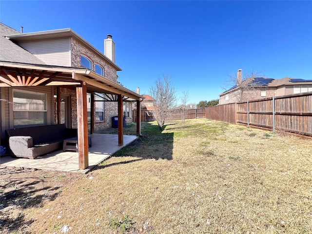 view of yard featuring a fenced backyard and a patio