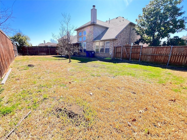 view of yard featuring a fenced backyard