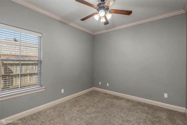 spare room with baseboards, a ceiling fan, carpet flooring, and crown molding