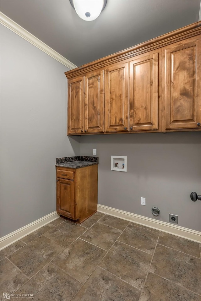 laundry area featuring baseboards, washer hookup, ornamental molding, cabinet space, and hookup for an electric dryer