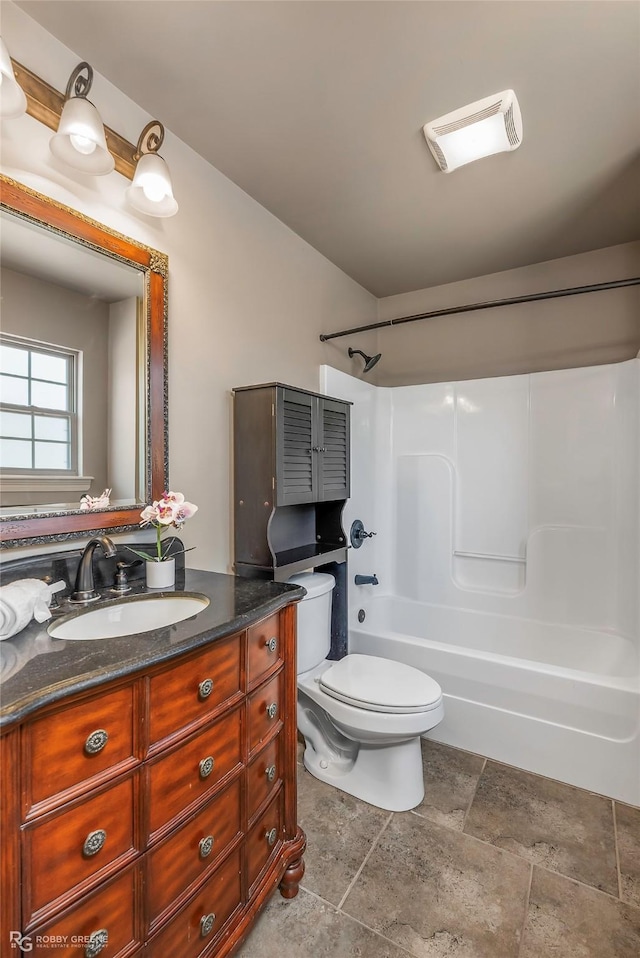 bathroom featuring shower / bath combination, toilet, and vanity