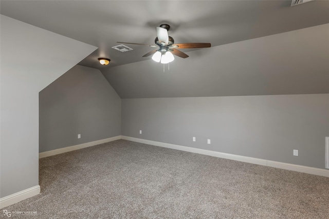 additional living space featuring visible vents, carpet flooring, baseboards, and ceiling fan