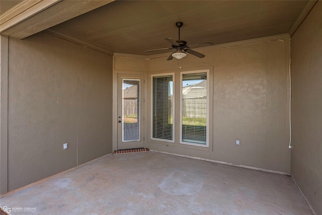 unfurnished room with concrete floors, crown molding, wood ceiling, ceiling fan, and a textured wall