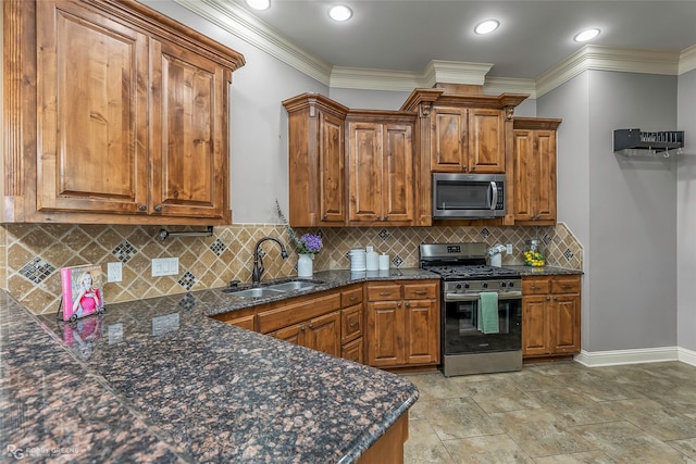 kitchen with crown molding, brown cabinets, appliances with stainless steel finishes, and a sink