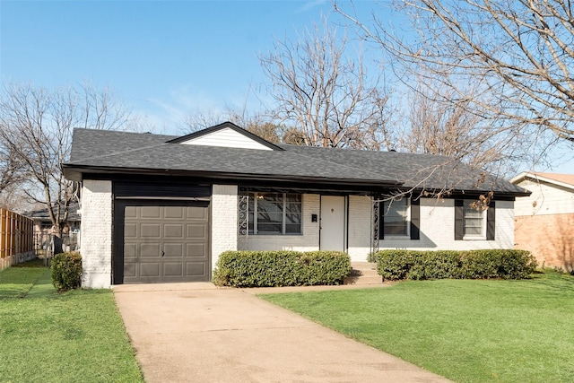 ranch-style home with brick siding, a shingled roof, a front lawn, concrete driveway, and an attached garage