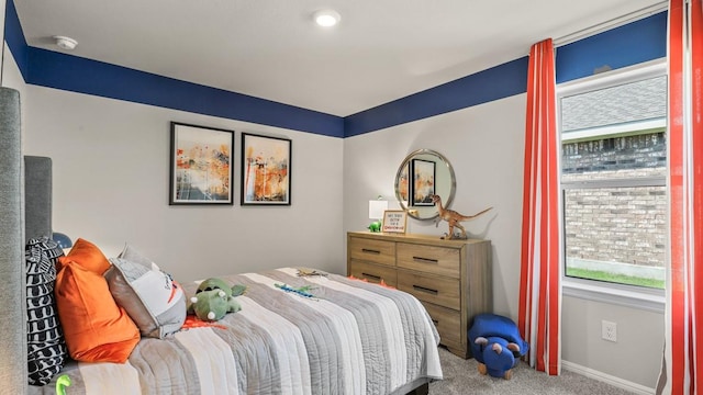 bedroom with baseboards and carpet flooring