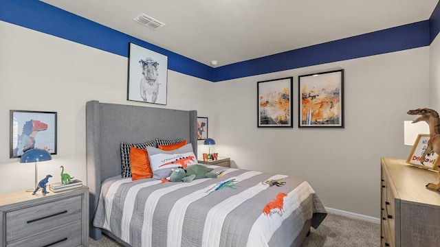 bedroom with visible vents, carpet floors, and baseboards