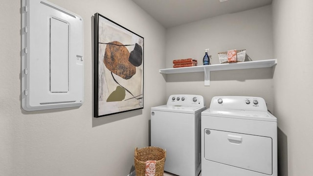 washroom with laundry area and washing machine and dryer