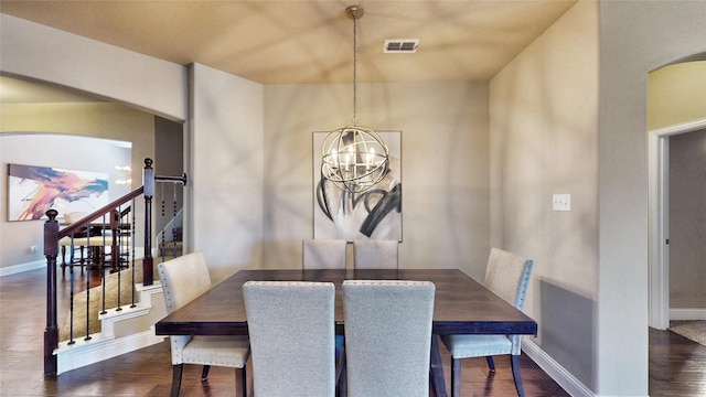 dining space featuring visible vents, stairway, baseboards, a chandelier, and dark wood-style flooring