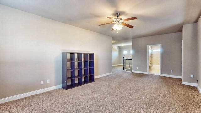 unfurnished room featuring ceiling fan, baseboards, and carpet floors