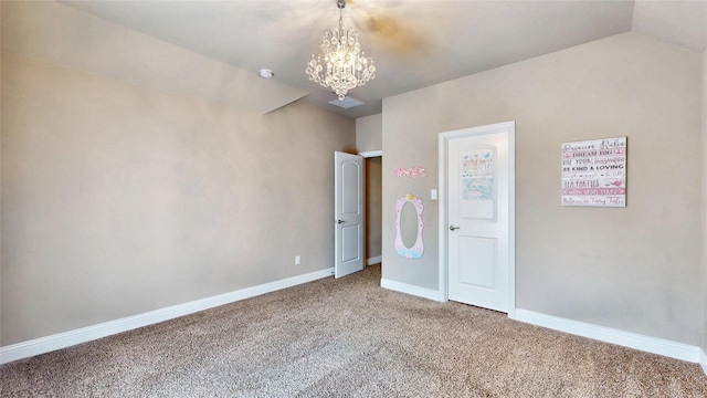 unfurnished bedroom featuring baseboards, a notable chandelier, carpet flooring, and vaulted ceiling