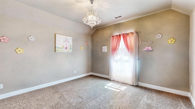 carpeted spare room featuring baseboards, lofted ceiling, visible vents, and an inviting chandelier