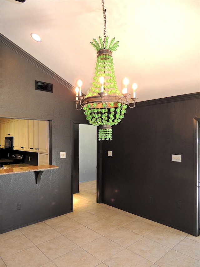 kitchen with visible vents, ornamental molding, cream cabinets, black microwave, and lofted ceiling