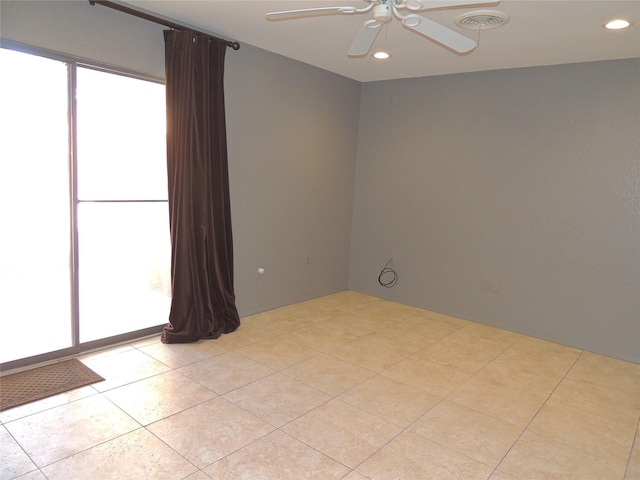 empty room featuring light tile patterned floors, recessed lighting, visible vents, and ceiling fan