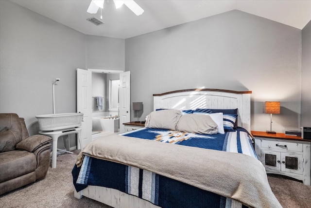 bedroom featuring visible vents, connected bathroom, ceiling fan, lofted ceiling, and carpet flooring