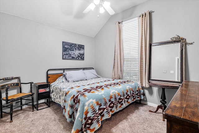 bedroom with baseboards, carpet flooring, a ceiling fan, and lofted ceiling