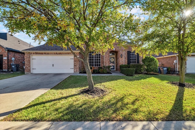 view of property hidden behind natural elements featuring a front lawn, brick siding, concrete driveway, and an attached garage