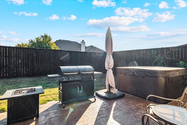2604 Leisure Ln, Little Elm, TX 75068 - view of patio / terrace with a hot tub, an outdoor fire pit, and a grill