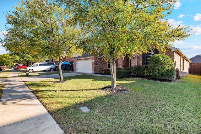 view of property hidden behind natural elements with a front lawn, brick siding, and driveway