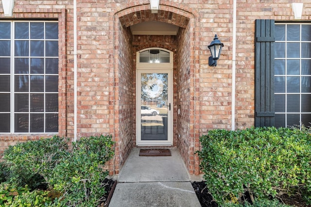 entrance to property with brick siding