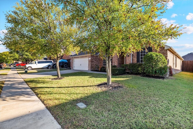 2604 Leisure Ln, Little Elm, TX 75068 - obstructed view of property with driveway, brick siding, a front lawn, and an attached garage