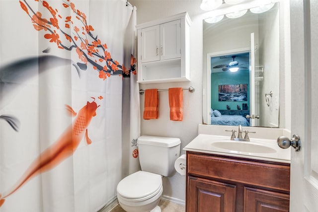 ensuite bathroom with baseboards, vanity, toilet, and ensuite bathroom