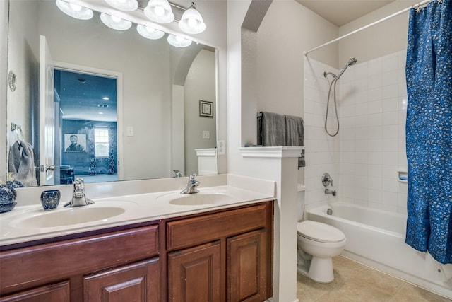 full bathroom with tile patterned floors, toilet, a sink, shower / bath combination with curtain, and double vanity