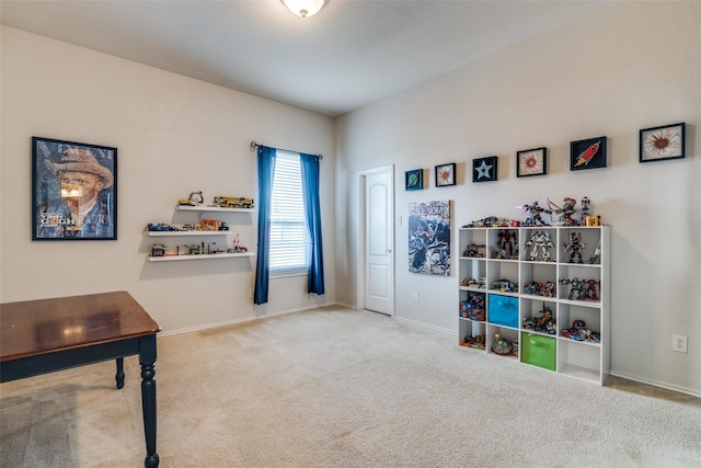 interior space featuring carpet flooring and baseboards