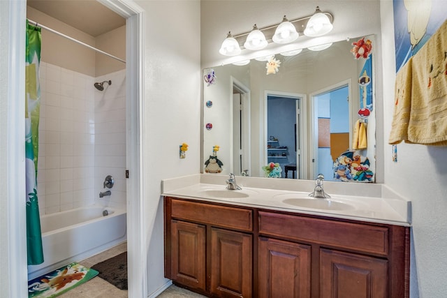 bathroom featuring double vanity, shower / bath combo with shower curtain, and a sink