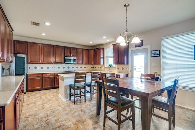 dining room with recessed lighting, visible vents, and a chandelier