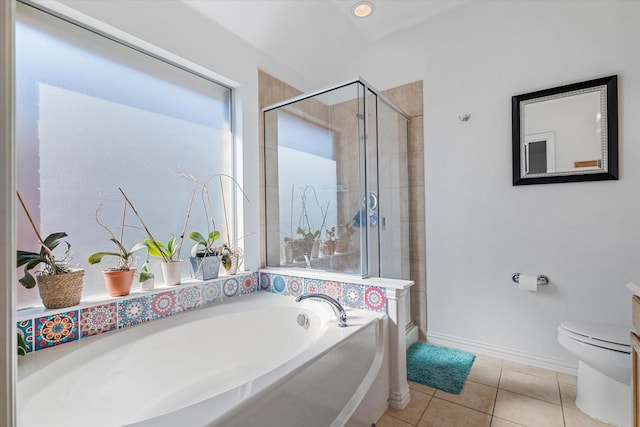 full bathroom with a bath, baseboards, a stall shower, tile patterned flooring, and toilet