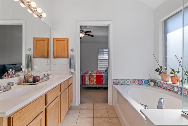 full bath featuring a sink, connected bathroom, a bath, and tile patterned floors