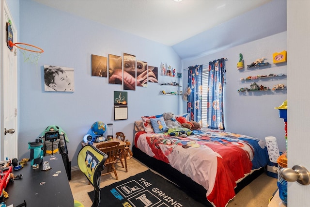 bedroom featuring vaulted ceiling and carpet flooring