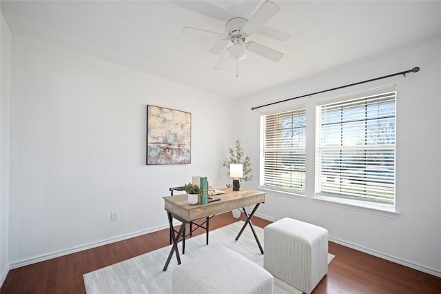 office featuring baseboards, a ceiling fan, and wood finished floors