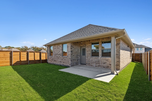 1817 Forest Wood, Mesquite, TX 75181 - back of property with a shingled roof, brick siding, a fenced backyard, and a patio
