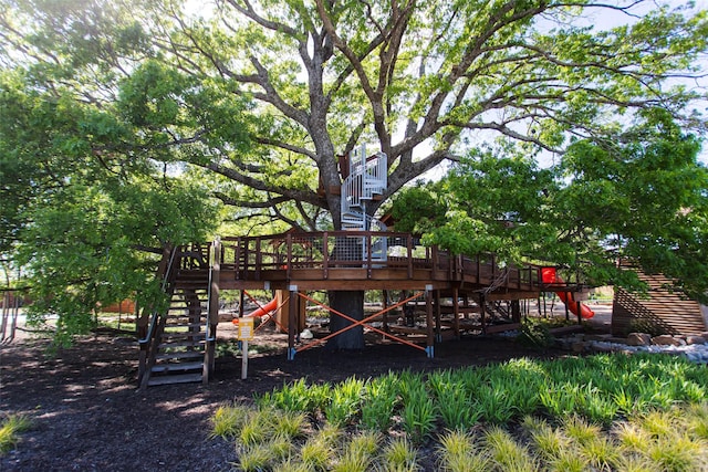 1817 Forest Wood, Mesquite, TX 75181 - view of play area featuring stairway and a wooden deck